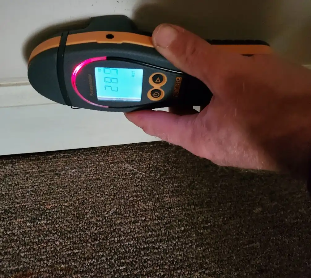 Moisture detection at baseboard during Storm Damage Restoration in Sioux Falls